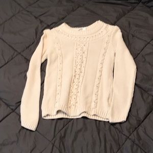 Cream sweater with jewels on it
